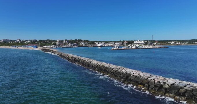 New Shoreham, RI, USA - August 8, 2026  Block Island, Rhode Island summer arial video of the breakwater barrier at Old Harbor.