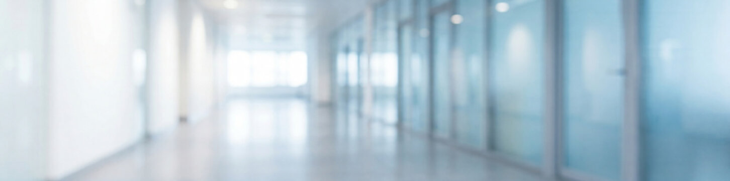 panoramic blurred empty office hallway with glass doors, clean minimalist corporate corridor interior, bright modern workspace background ideal for business, tech, healthcare and website headers