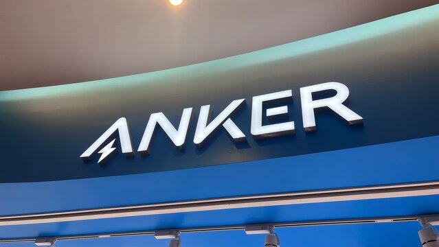 Anker Store exterior signage with illuminated white 3D letters and corporate logo displayed at a modern retail electronic shop entrance - Osaka, Japan, September 24, 2024