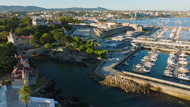 Aerial view of Santa Marta lighthouse and Cascais marina with Cascais cityscape