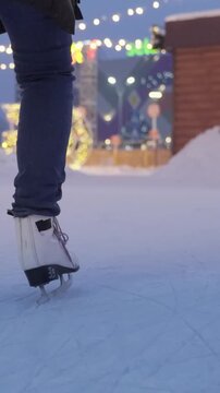 Ice Skating Lesson For Newcomers. Quiet Winter Night On Ice With Firsttime Skaters Beneath Festive Lights. Serene Winter Evening Featuring Novice Skaters Learning To Glide On Frozen Ice Surface