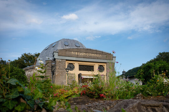 the domed Nibelungenhalle in Konigswinter, Germany. Historic temple architecture dedicated to Richard Wagner, surrounded by flowers and greenery