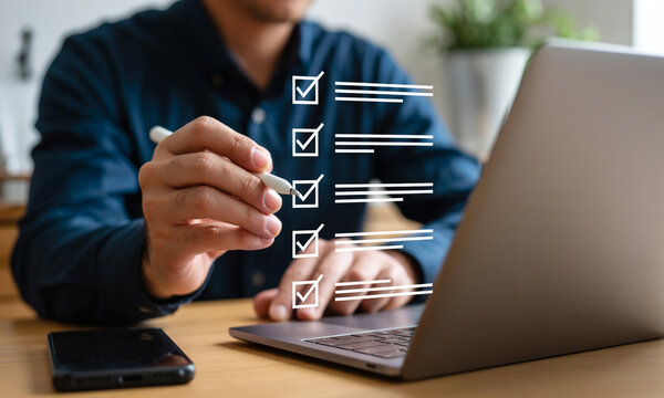 Person checking off items on a digital list checklist task