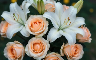 Fototapeta premium Elegant white lilies and peach roses in a soft romantic floral