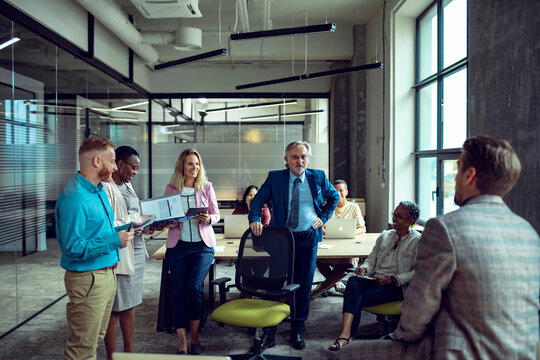 Diverse business team discussing strategy in modern office
