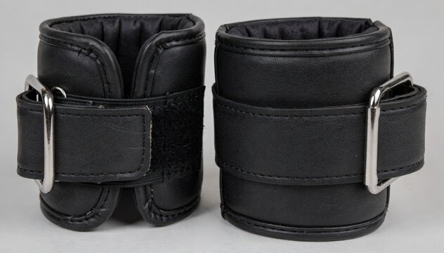 Medium shot featuring ankle cuffs made of durable leather with soft padding and reinforced straps emphasizing comfort and firm hold during use.