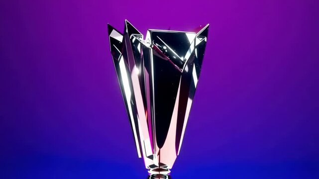 A shiny trophy cup sits on a table against a vibrant purple and blue gradient background, symbolizing achievement and success in a competitive event