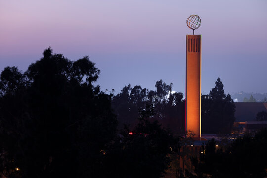 Los Angeles, California, USA - March 22, 2026: Twlight descends behind the Globe topped tower of the Von KleinSmid Center on the Campus of USC.