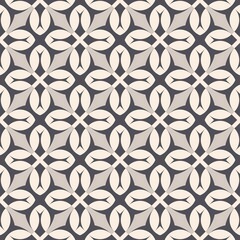 Fototapeta premium A black and white patterned tile floor. The pattern is made up of squares and circles. The tiles are arranged in a way that creates a sense of depth and dimension