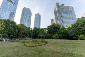 Obraz premium city park with modern building background in shanghai