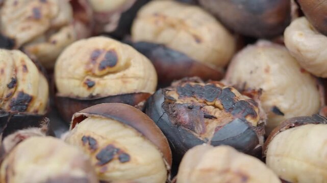 Roasting chestnuts at a local market during autumn afternoon