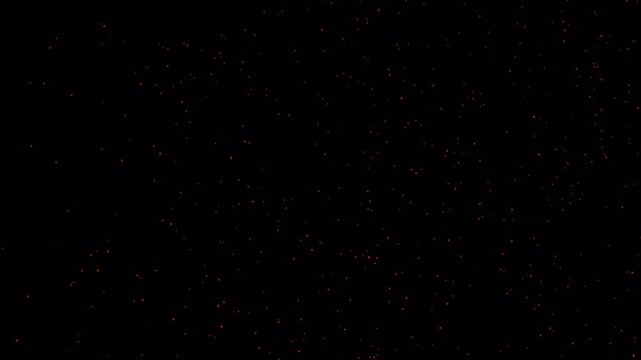 Fire particles animation. Glowing ember sparks floating with cinematic heat effect on dark background
