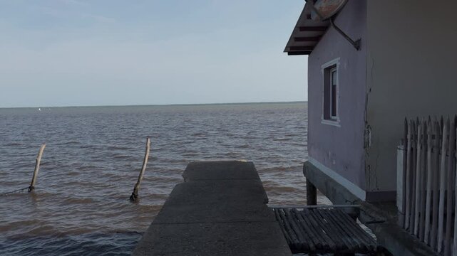 Walking beside a stilt house with open view of Lake Maracaibo, Venezuela