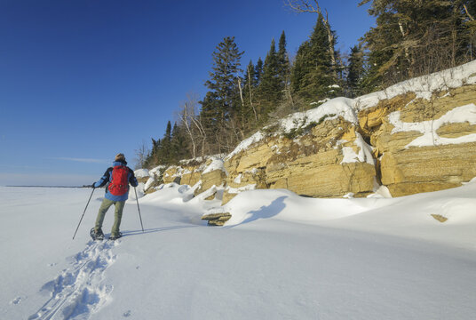 snowshoeing  along  cliffs, Hecla/Grindstone Provincial Park, along Lake Winnipeg, Canada