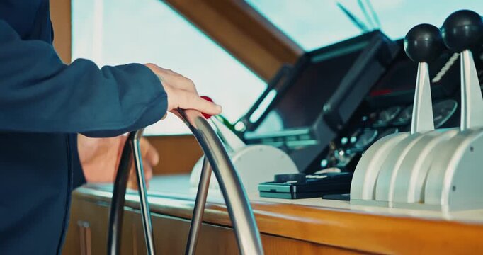 Captain Operating Ship Controls on Yacht Bridge