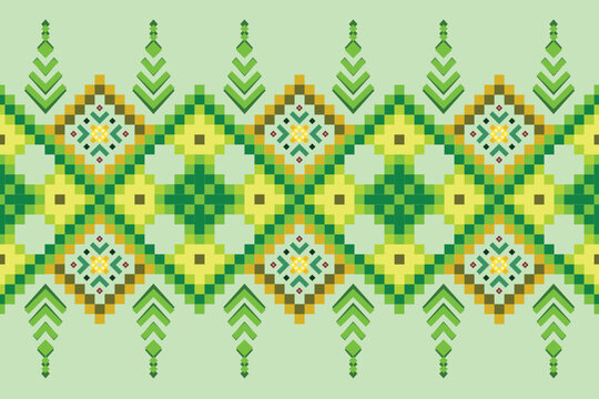 A decorative pixel art border featuring green and yellow geometric motifs. The design combines diamond shapes with stylized arrowhead or pine tree symbols.