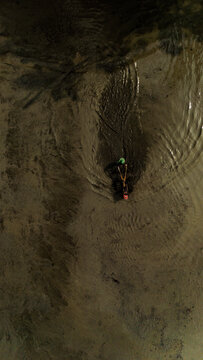 Vertical top-down view of farmer using tracktor