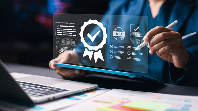 Businessman using laptop with digital checklist and quality badge icon. Concept of quality assurance, compliance audit, certification approval, document management and business standard control.
