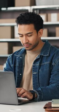 Businessman, typing and boxes with laptop in logistics for supply chain, online order or schedule. Man, employee or distributor with computer for inventory, stock control or small business startup