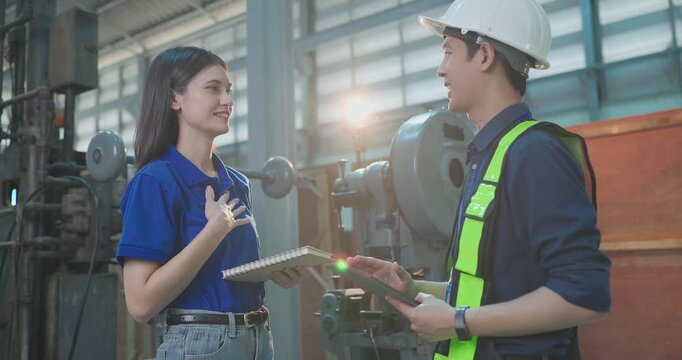Female startup entrepreneur and male engineer greet each other, shake hands and begin a product discussion in a small lab workshop during an industrial collaboration meeting.
