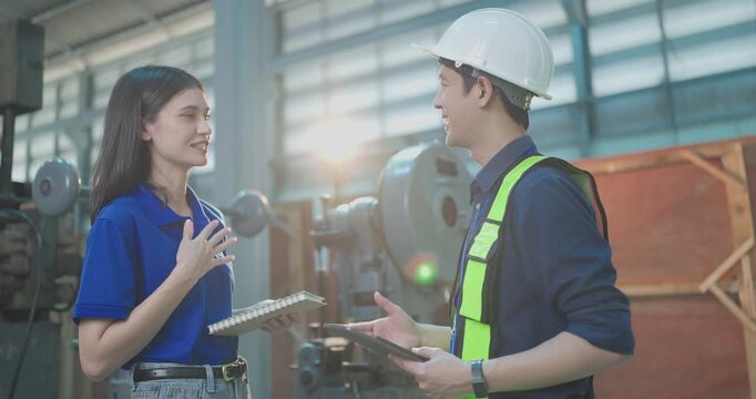 Female startup entrepreneur and male engineer greet each other, shake hands and begin a product discussion in a small lab workshop during an industrial collaboration meeting.
