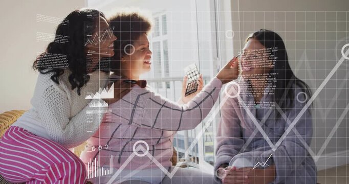 Vertical video: Tilting phone, center woman trying filter, adjusting robed woman by window, HUD