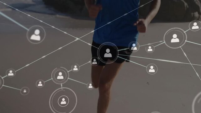 Male runner jogging along shore, camera panning upward sparking network icons tracking fitness data