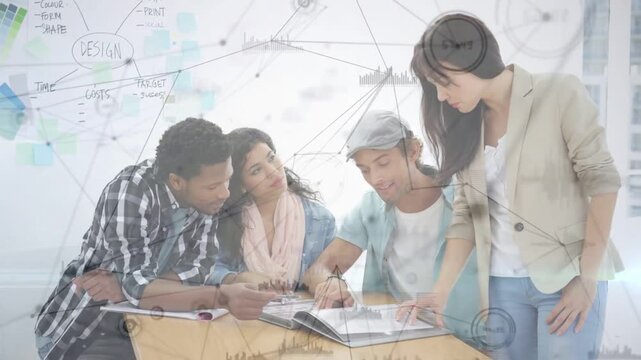Fourth person coming from right, leaning over binder, pointing; trio following, finalizing design