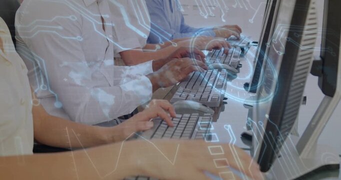 Coworkers in shirts typing on keyboard at desk as circuit overlay appearing highlighting data tasks