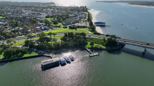 Aerial: drone descending towards public jetty in Sans Souci, Sydney