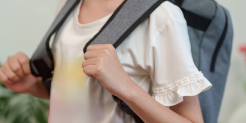 Naklejka premium Child wearing a backpack ready for school