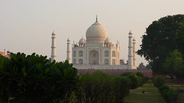 White marble mausoleum with symmetrical Mughal architecture
