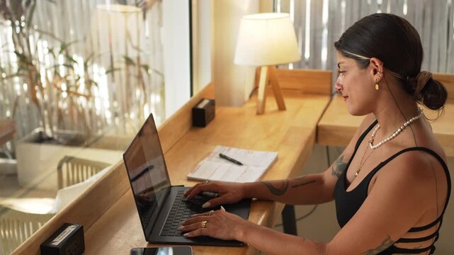 4K Video Close-Up of Laptop Work by Window at Sunset &ndash; Remote Work, Digital Nomad and Soft Natural Light