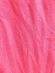 Fototapeta premium Top view of pink fabric texture background with soft wrinkles and tie dye pattern for fashion design or abstract backdrop.