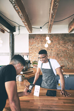 Waiter, man and scan with phone at cafe for qr code, digital menu and online payment. Smile, barista and person with mobile for fintech, contactless transaction and customer service at coffee shop