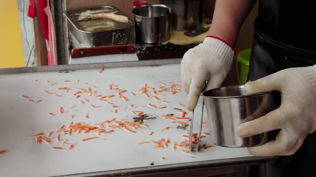 The making of stone-ground rice noodle rolls, a specialty food of Guangdong and Guangxi provinces in China