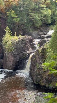 waterfaBig Manitou Falls and Manitou Falls Trail along the Black River south of Superior in Wisconsin&rsquo;s Douglas Countyll in the forest