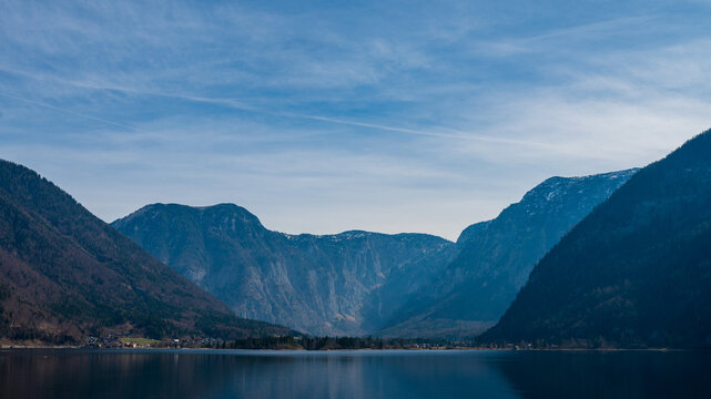 Alpine lake, river with mountain reflections and dramatic mountains in Austria