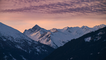 Obraz premium Sunset over mountains and spruce forest in Alps, Austria