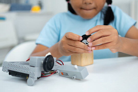 Student Girl Robotics technology in classroom