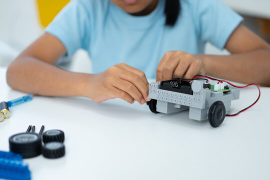 Student Girl Robotics technology in classroom