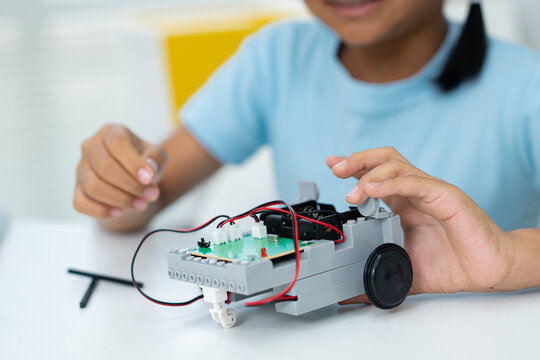 Student Girl Robotics technology in classroom