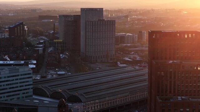 Aerial video of Manchester Cityscape at Sunrise featuring Piccadilly Train Station. 