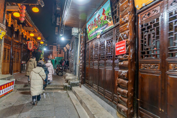 Obraz premium Furong Ancient Town is more than 2000 years old and home to the Tujia and Miao people, ethnic minorities in China, with lighting waterfall, The famous tourist destination at Hunan Province, China