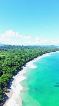 Aerial drone view of large shipwreck on tropical beach with jungle, Puerto Viejo Costa Rica