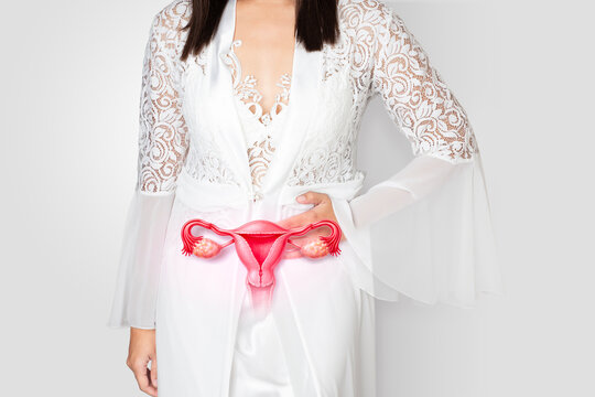 Female in white lace nightwear holding abdomen with highlighted uterus, symbolizing gynecological disorders, pain, hormonal imbalance, and reproductive health issues