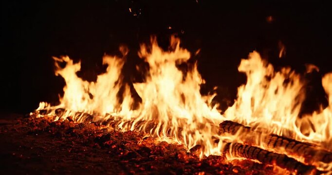 Burning wood at night time fire.