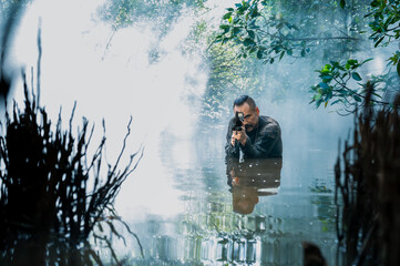 Fototapeta premium Special Forces Soldier in Jungle with Smoke, Tactical Military Operation