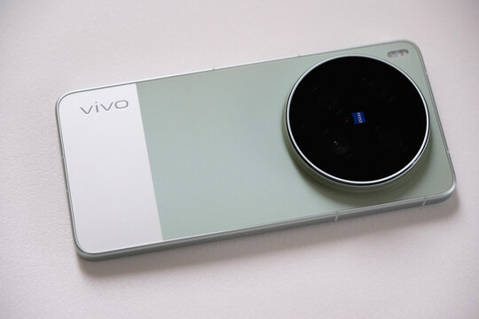Shanghai,China-April 3rd 2026: close-up a green Vivo X300 Ultra smartphone, circular ZEISS camera module on back