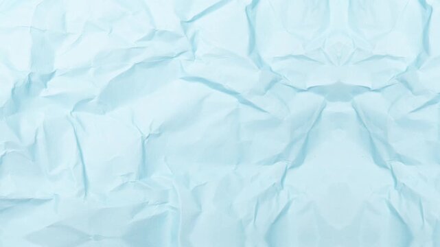 The crumpled blue paper texture provides a unique background for creative projects and designs 0403